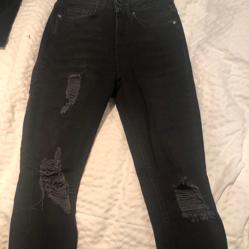 Black ripped skinny jeans with fringe